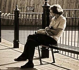 woman sitting at a bench