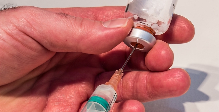 Doctor Filling Syringe