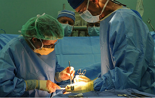 Surgeons Operate On Patient
