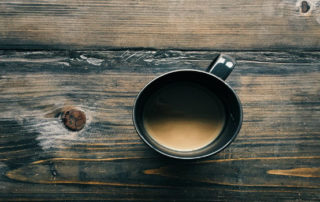 cup of coffee on wooden table