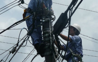 electricians working on power lines