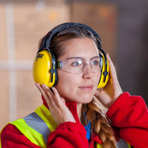 factory worker wearing protective hearing gear