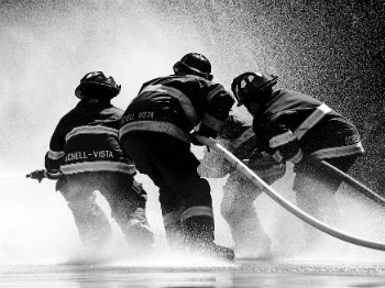 firefighters using hose