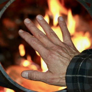 hand in front of fire