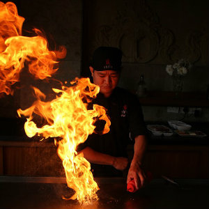 hibachi chef cooking with fire