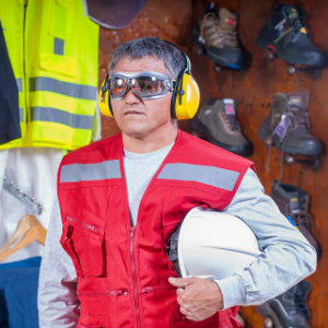 man wearing protective goggles and hearing gear