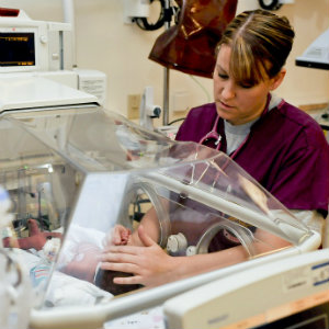 nurse with newborn baby