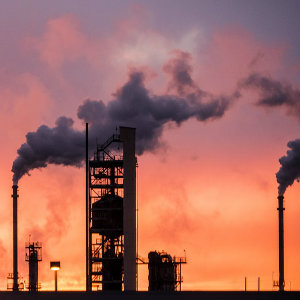 refinery smoke at sunset