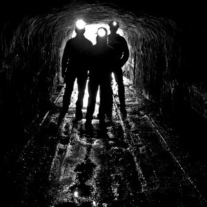 silhouettes of 3 coal miners