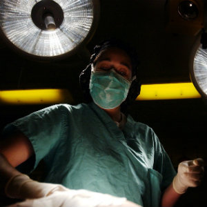surgeon under white lights