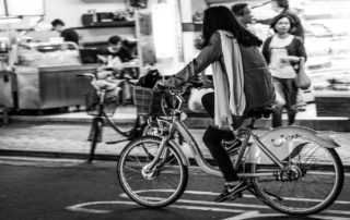 woman cycling in city