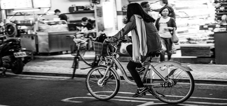 woman cycling in city