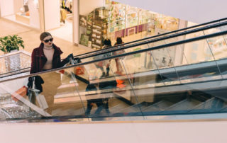 woman on shopping mall escalator